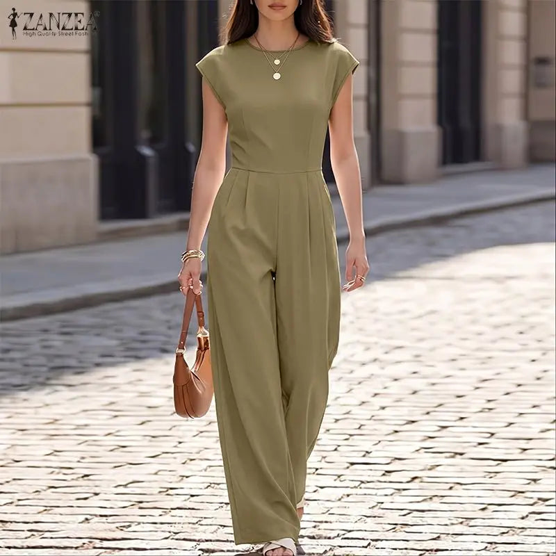Woman wearing the Celina Studio Ava Essential Wide-Leg Jumpsuit in Sage Olive.