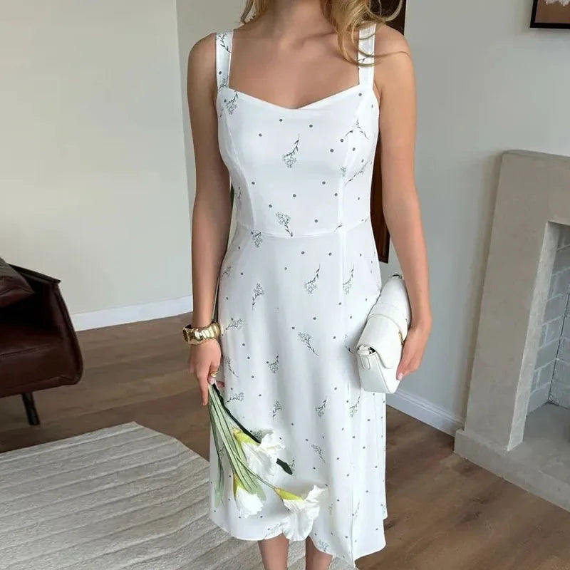 Model wearing the Celina Studio Floral Split Midi Dress outdoors.