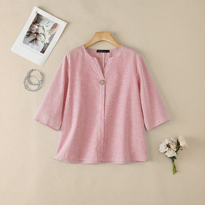 Pink striped V-neck roll sleeve blouse flat lay.