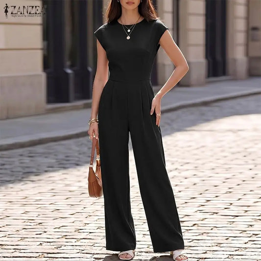 Woman wearing the Celina Studio Ava Essential Wide-Leg Jumpsuit in Midnight Black.