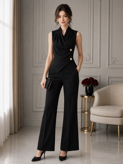 Woman wearing a black draped sleeveless blouse with decorative gold-tone buttons.
