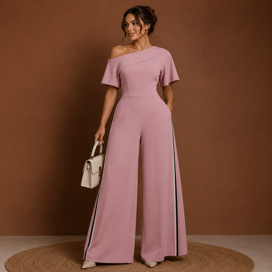 Blush Pink off-shoulder wide-leg jumpsuit by Celina Studio featuring a fitted bodice, short sleeves, and elegant full-length trousers.