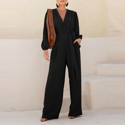 Full-length view of the Celina Studio Élan Wrap Wide-Leg Jumpsuit in Midnight Black.