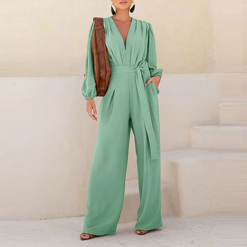 Woman wearing the Celina Studio Élan Wrap Wide-Leg Jumpsuit in Sage Mist with a relaxed wide-leg silhouette.