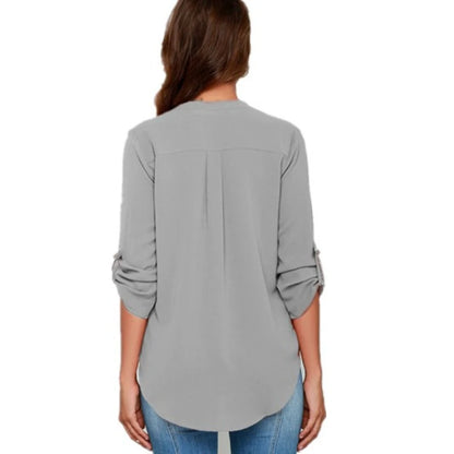 Back view of a gray roll sleeve blouse with a relaxed fit.