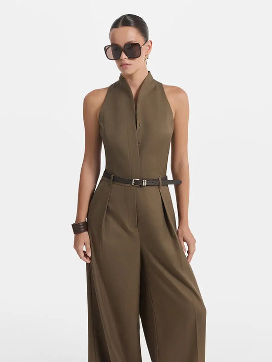 Three-quarter view of the Celina Studio Lumière Halter Tailored Wide-Leg Jumpsuit in Pearl Ivory.