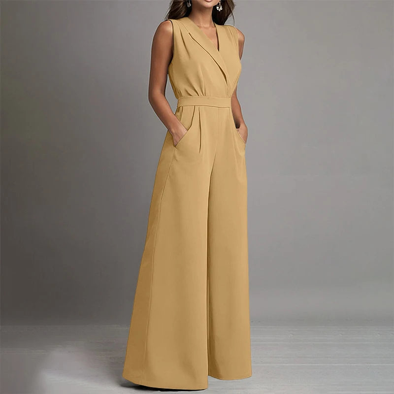 Mustard Yellow sleeveless wide-leg jumpsuit by Celina Studio designed with a flattering V-neckline and flowing wide-leg trousers.