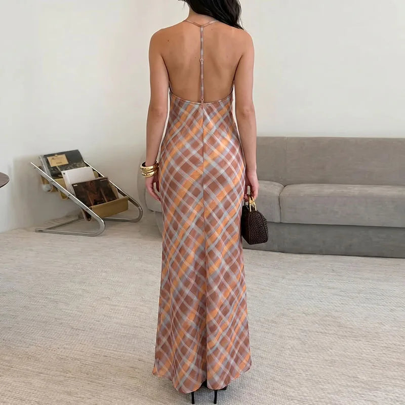 Back view of an orange plaid spaghetti strap maxi dress for women.