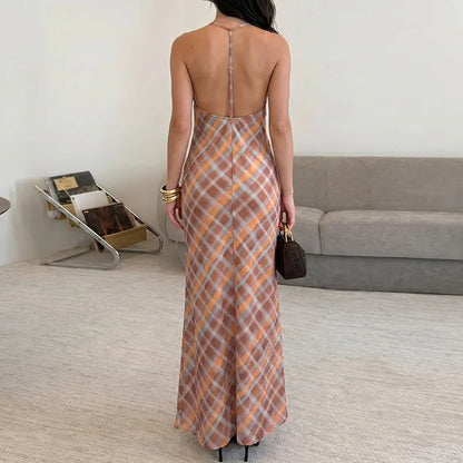 Back view of an orange plaid spaghetti strap maxi dress for women.