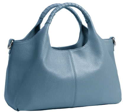 Woman carrying a sky blue soft leather shoulder tote bag.