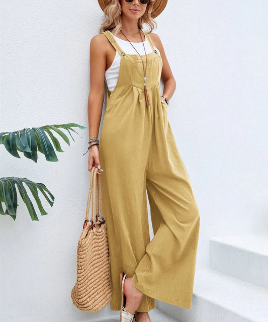 Woman wearing the Celina Studio Solstice Relaxed Wide-Leg Overall Jumpsuit in Golden Sand.